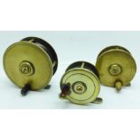 Three brass fishing reels