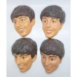 The Beatles, four vintage painted plaster head wall plaques, Paul, George, John and Ringo