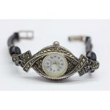 A lady's silver mounted and marcasite wristwatch, (stainless steel case back)