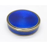 A circular French silver and blue enamel pill box, c. 1910, 38mm