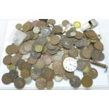 A collection of coins including Victorian and a pocket watch movement