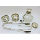 Six silver items;- two napkin rings, a pair of Victorian sugar bows, one other small pair of sugar