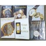 A collection of watch books including Watches International and Patek Phillippe