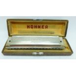 A Hohner The 64 Chromonica professional model, cased