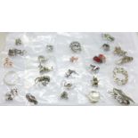 Twenty-five pairs of silver earrings