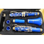 A sky blue Ferris clarinet, cased