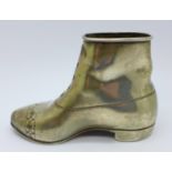 A Victorian silver match holder/striker, in the form of a boot, London 1898, 156g, weighted