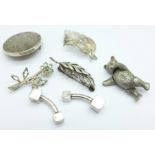 Five silver brooches including an articulated Teddy bear and a pair of silver cufflinks, 50g
