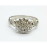 A 9ct white gold and diamond cluster ring, 0.5carat weight, marked on the shank, 2.6g, N