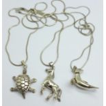 Three novelty, articulated silver pendants with chains, horse, seal and turtle, 36g