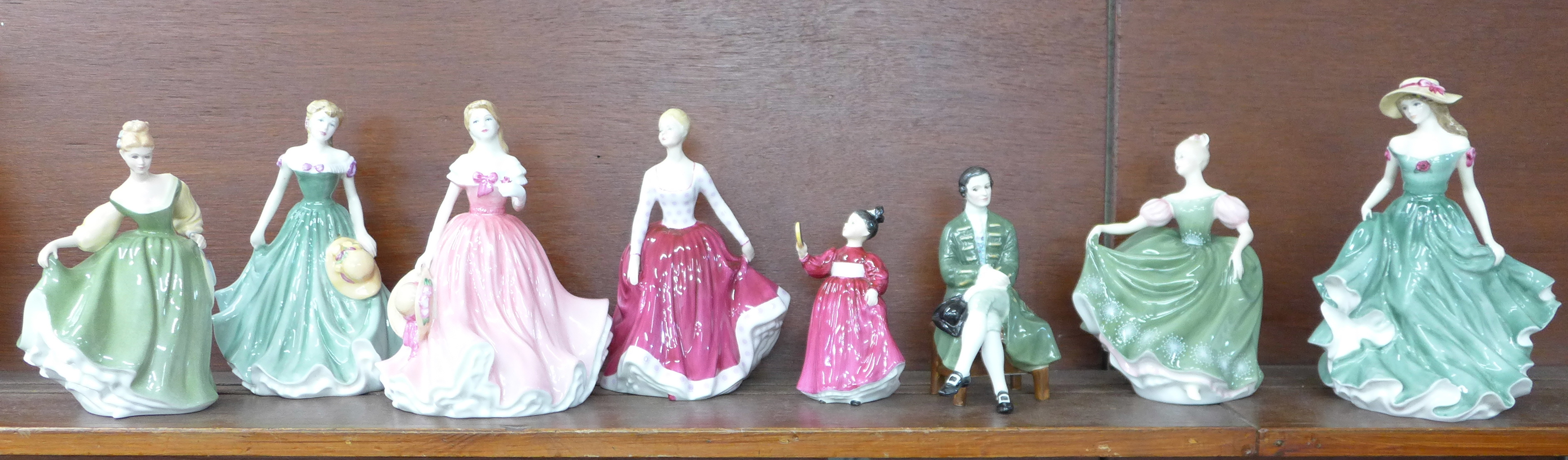 Eight Royal Doulton figures including a Gentleman from Williamsburg, Vanity, Fair Lady, Michelle and