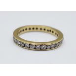 A yellow metal and diamond eternity ring, 2.5g, M