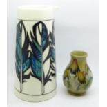 A Moorcroft 20cm jug, second, small chip to the base and 10cm Moorcroft toadstool vase, second