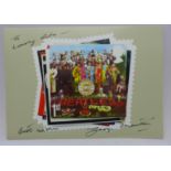 A The Beatles related autographed (modern) postcard, signed 'To Lovely Rita, Best Wishes George