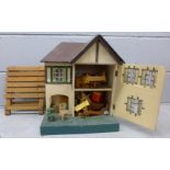 A Tri-ang dolls house and furniture