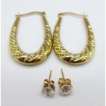 A pair of 9ct gold hoop earrings, 1.7g, and one other pair of yellow metal earrings