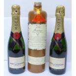Two bottles of Moet et Chandon Imperial Champagne and a stoneware bottle of Zuidam Genever