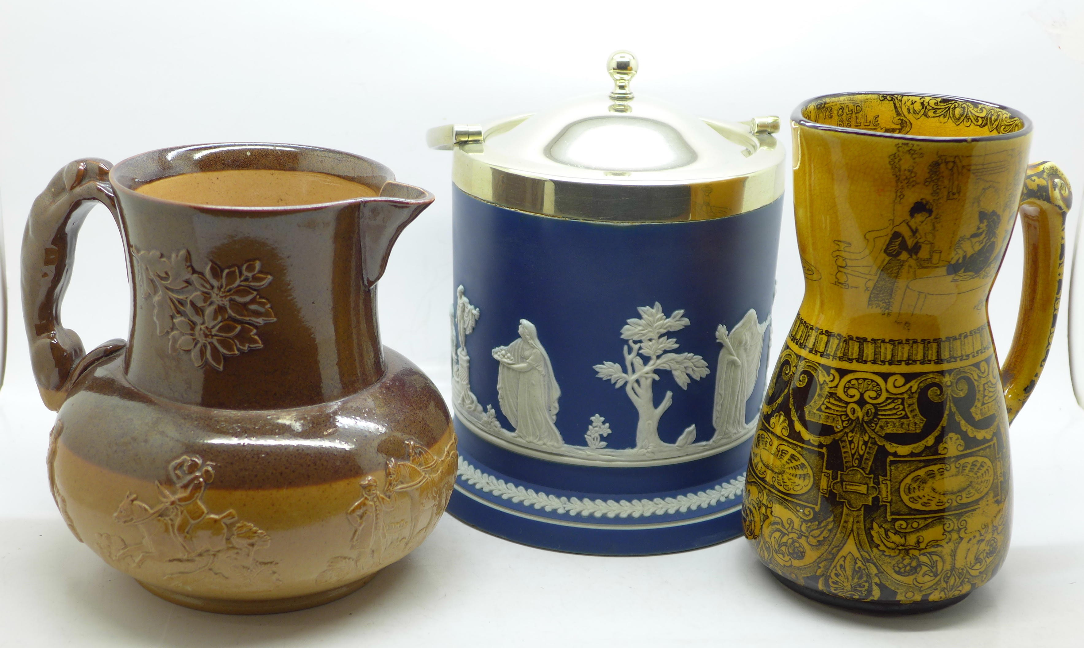 Two Doulton jugs, Jacobean and saltglaze and an Adams jasper biscuit barrel