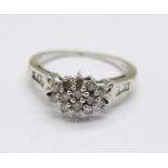 A 9ct white gold diamond cluster ring with diamond shoulders, 2.6g, N