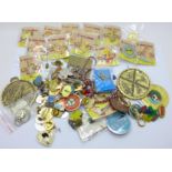 A collection of approximately 100 badges, mainly charity badges