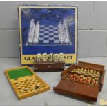 A collection of chess sets and a games compendium **PLEASE NOTE THIS LOT IS NOT ELIGIBLE FOR POSTING