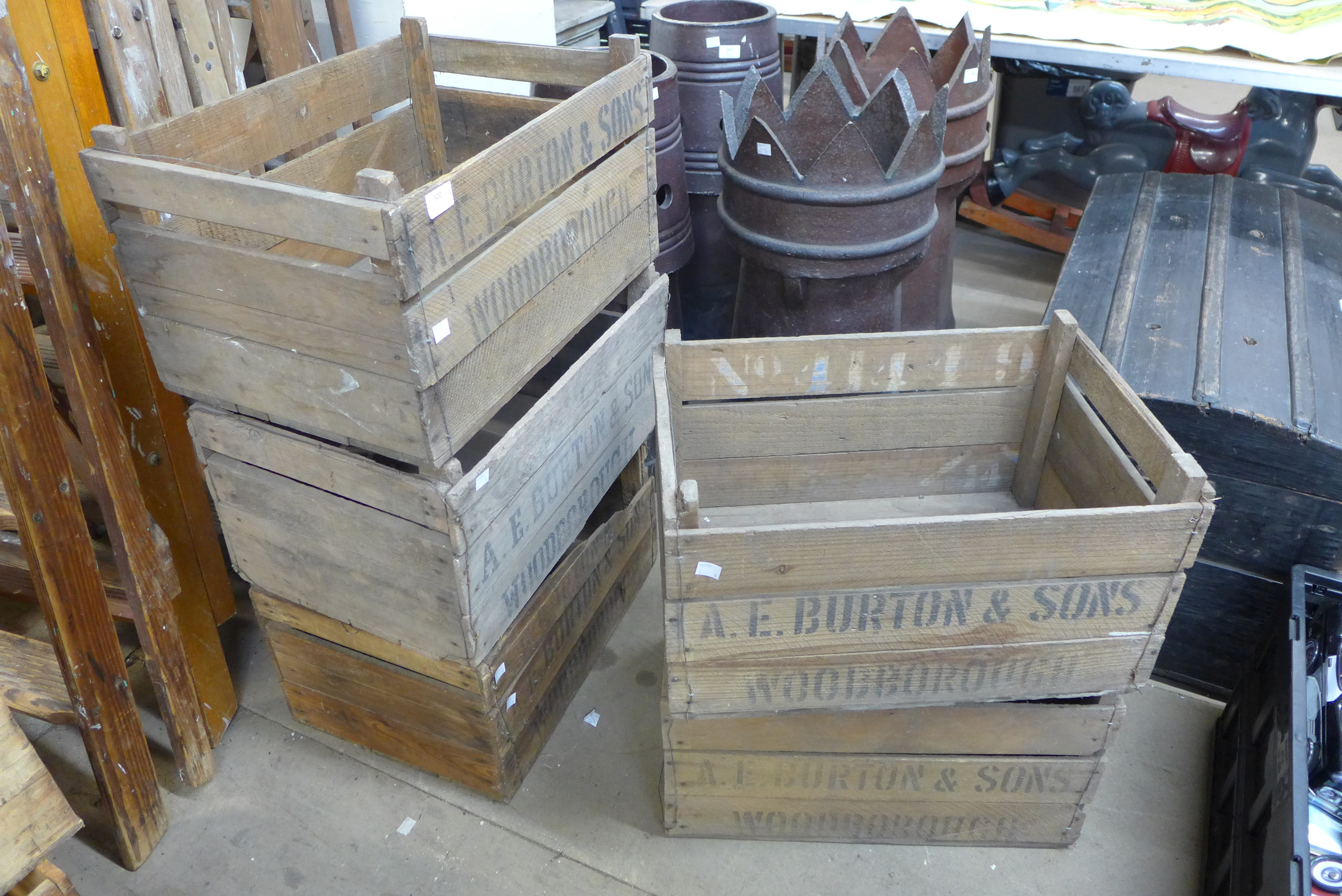 Five wooden A.E. Burton advertising crates