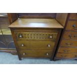 A Priory oak chest of drawers