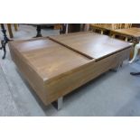 A simulated oak and chrome metamorphic coffee table