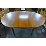 A Mcintosh teak extending dining table