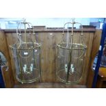 A pair of French style gilt metal cylindrical hanging ceiling lanterns