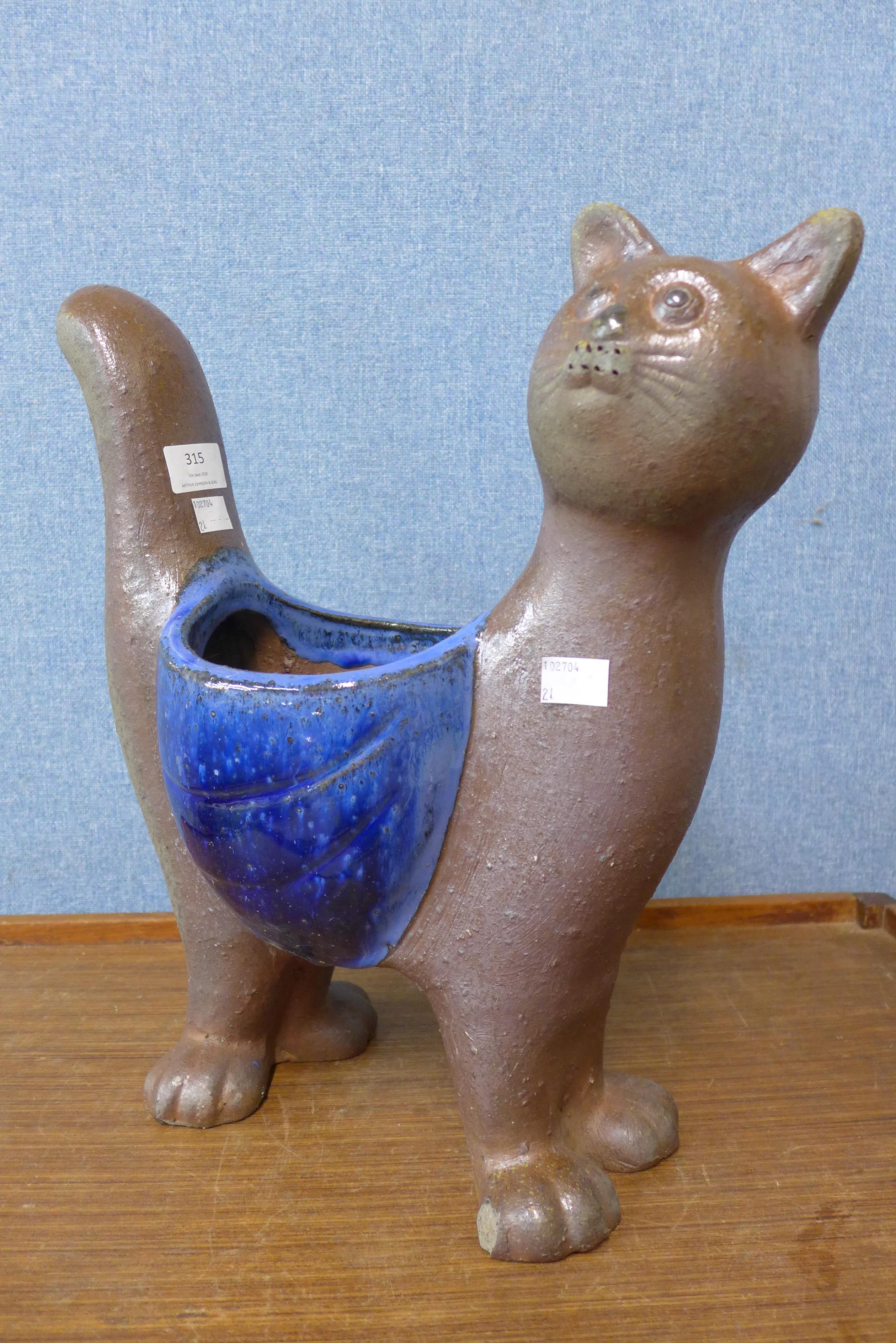 A figural cat garden planter