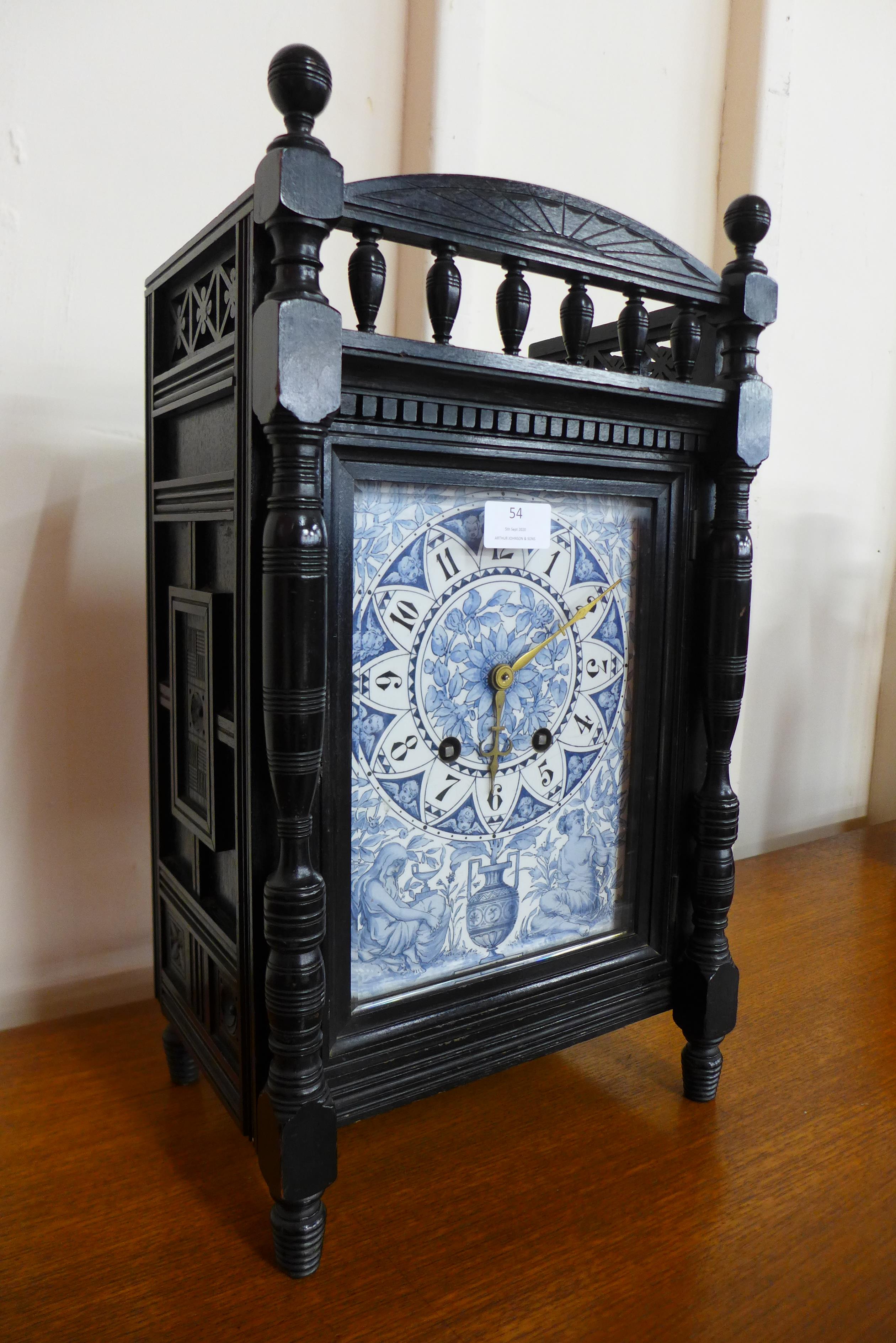 A Victorian Aesthetic Movement ebonised bracket clock, with blue and white porcelain dial, 48cms h