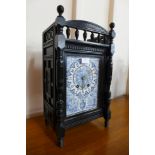 A Victorian Aesthetic Movement ebonised bracket clock, with blue and white porcelain dial, 48cms h