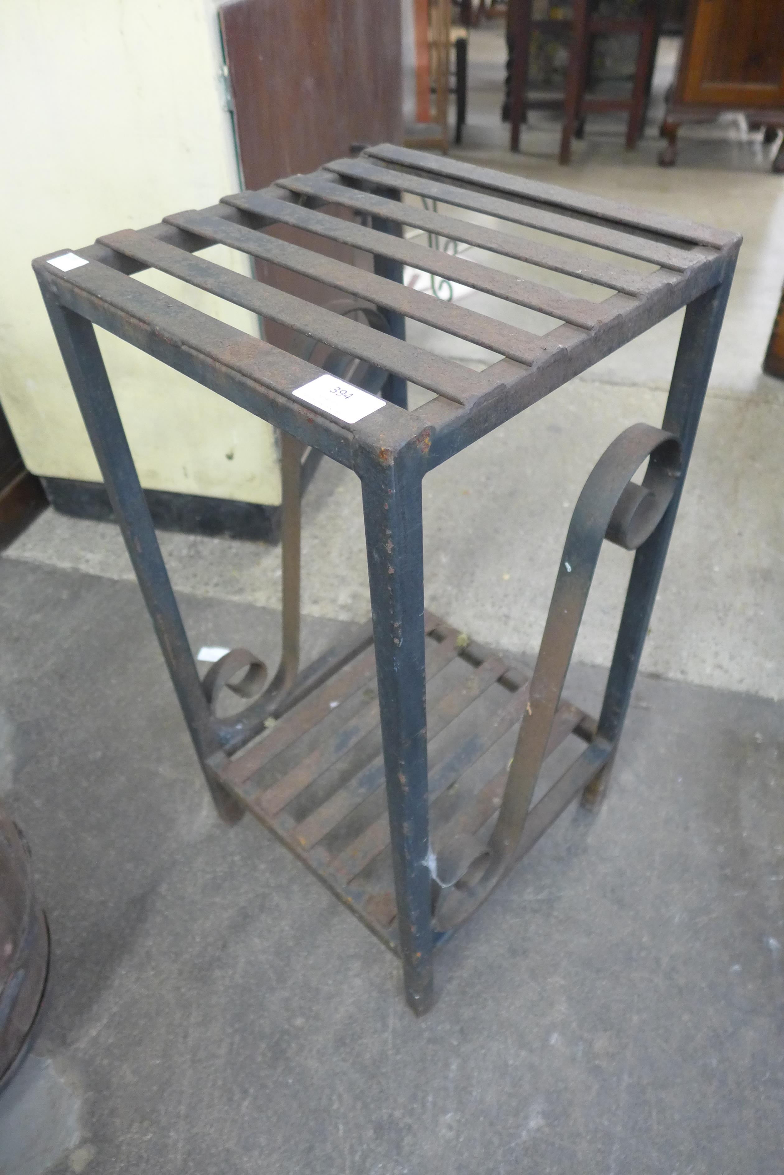 A wrought iron plant stand