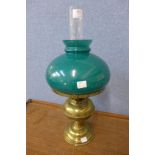 A brass and green glass oil lamp