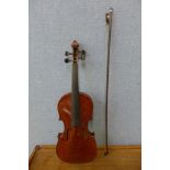 A violin and bow, cased