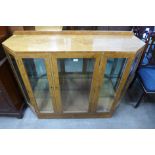 An Art Deco style birds eye maple display cabinet