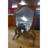 A mahogany shield shape toilet mirror