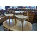 A pair of Danish Henning Kjaernulf for Bruno Hansen model 225 teak and cord seated chairs