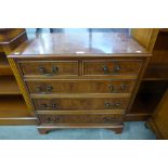 A yew wood chest of drawers