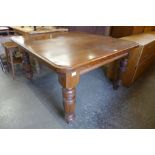 A Victorian oak dining table