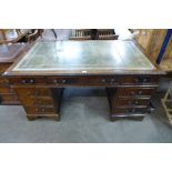 A mahogany and leather topped library desk