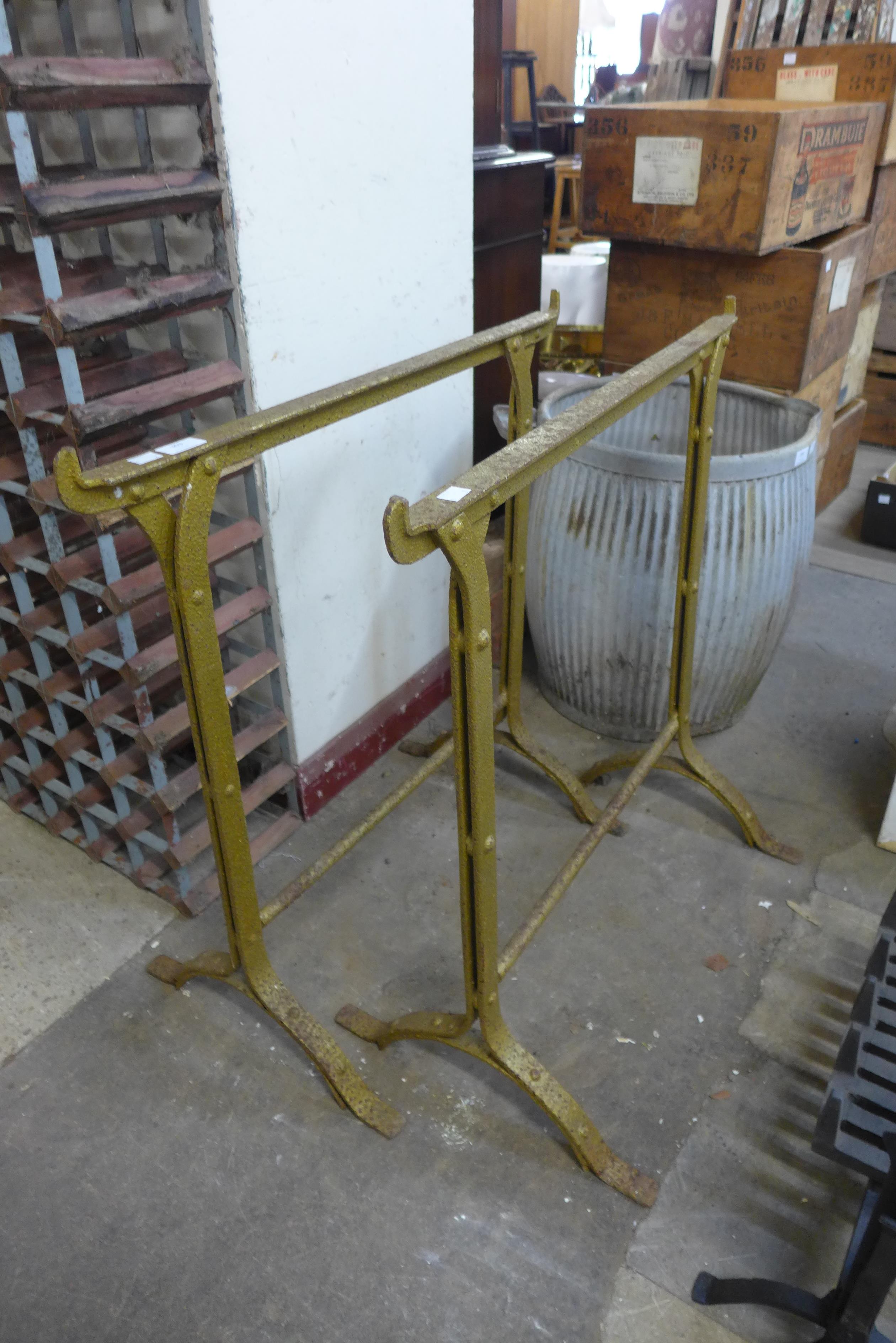 A pair of Victorian wrought iron trestles