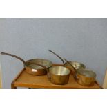 Four copper coated saucepans