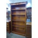 A yew wood open bookcase