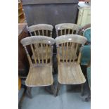 A set of four Victorian elm and beech kitchen chairs