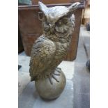 A gilt concrete garden figure of an owl