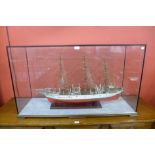 A Danmark model three mast ship, cased, 65cms h, 113cms w, 36cms d