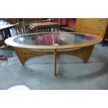 A G-Plan Astro teak and glass topped oval coffee table