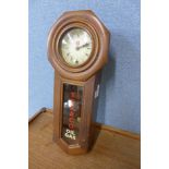 A walnut wall hanging timepiece, bearing Texaco Oil Gas inscription to the door